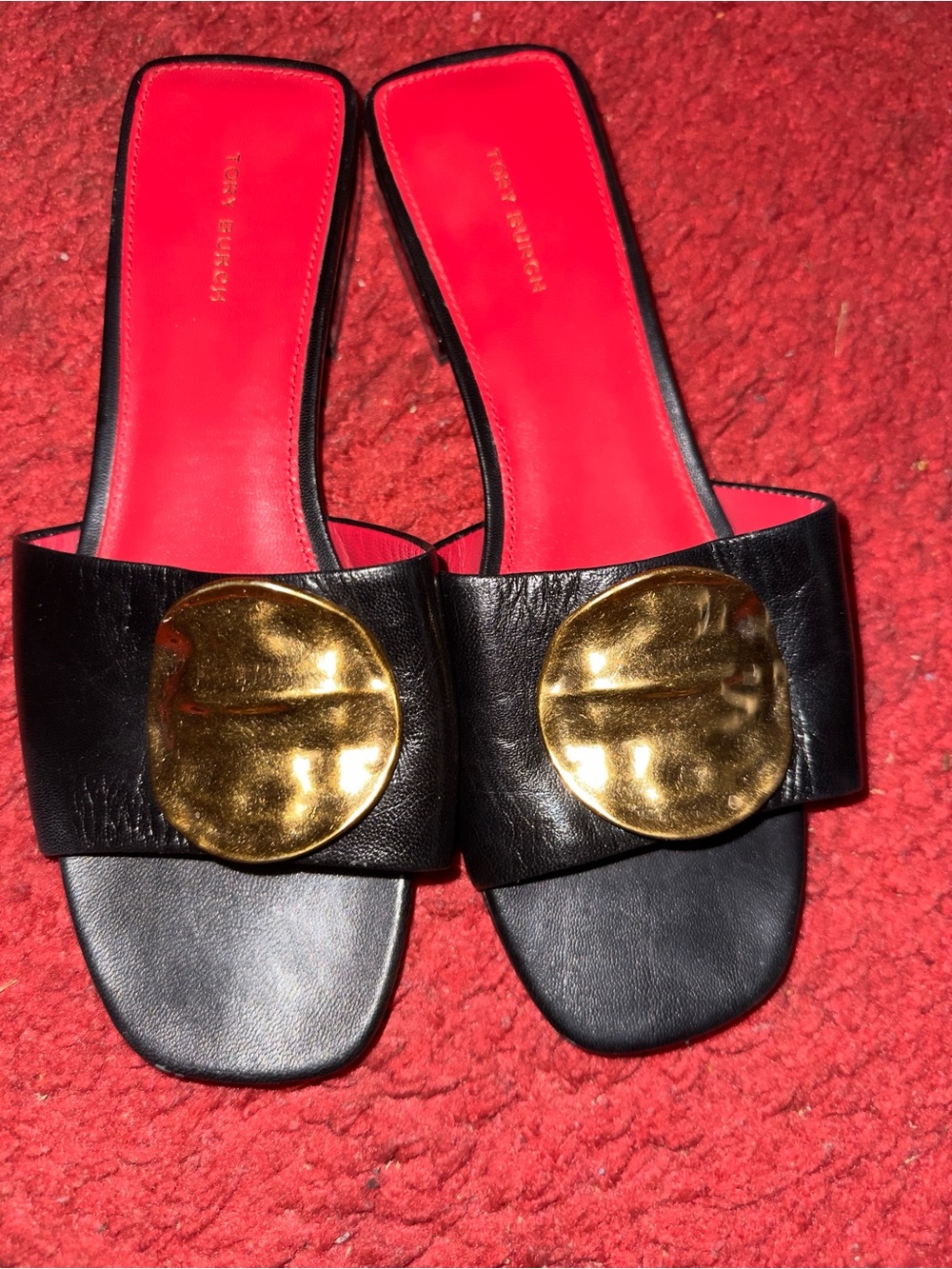 Tory Burch Black Leather Slide Mules with Gold Medallions and Red Insole